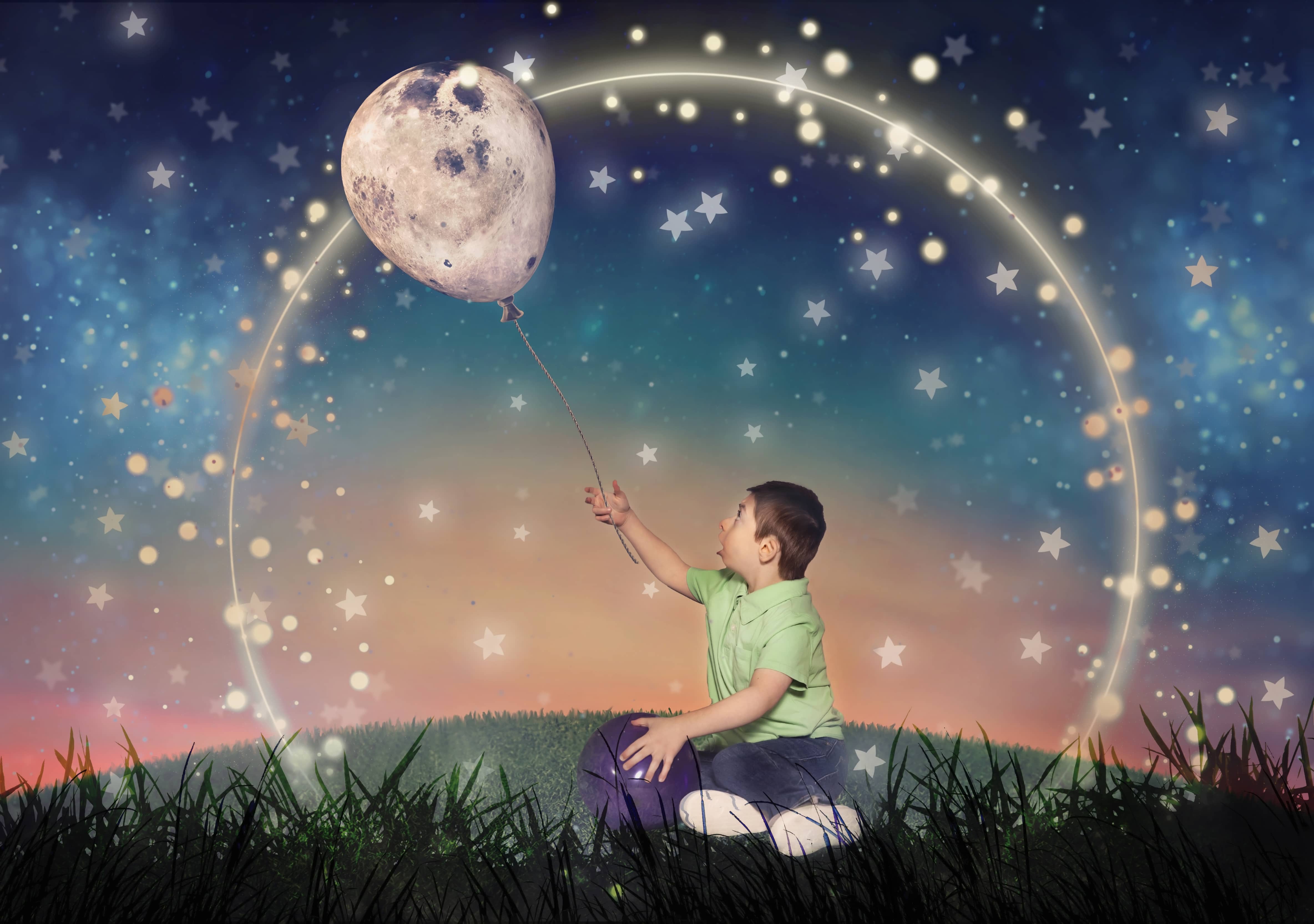 Boy holding a baloon