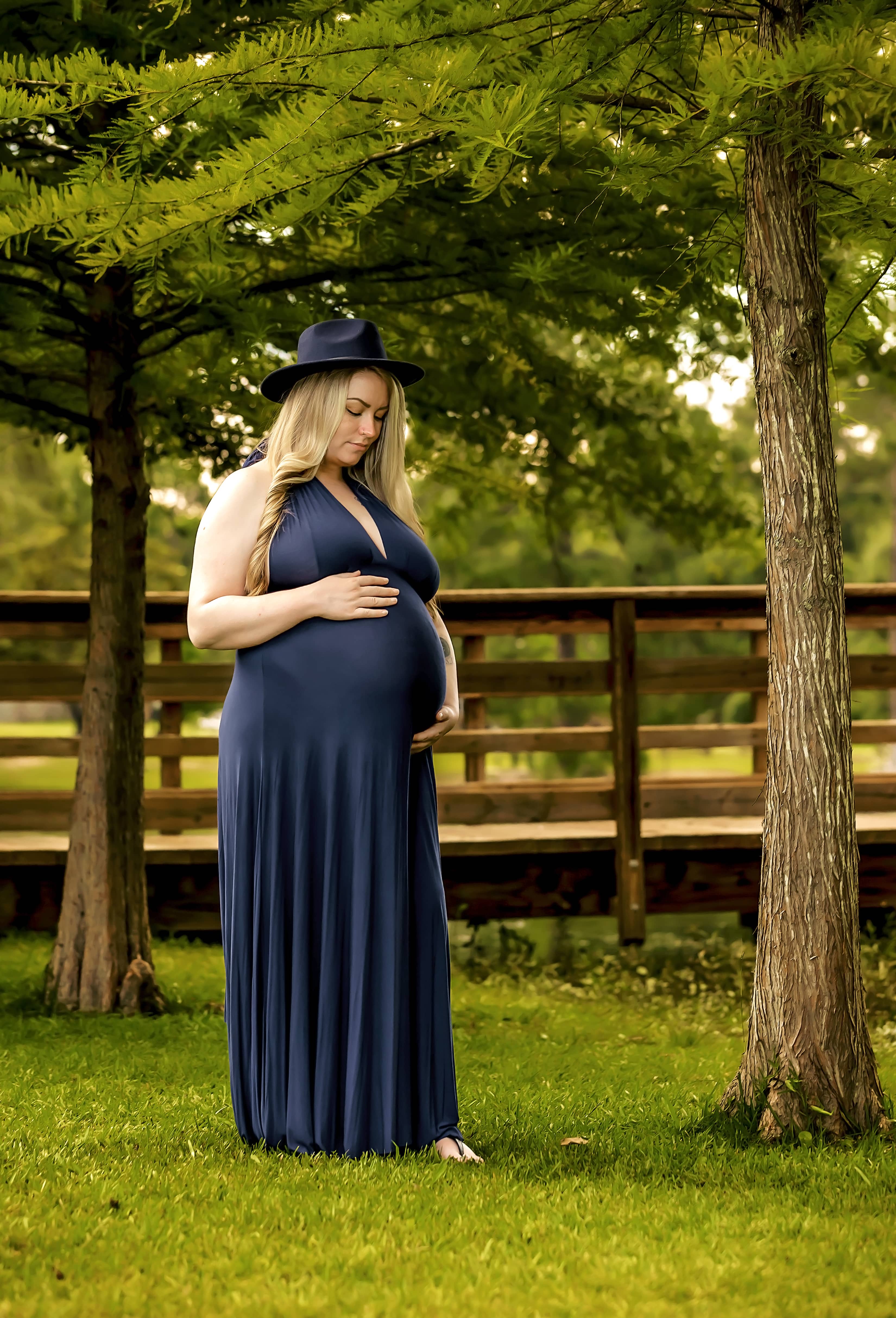 Pregnant woman holds her stomach