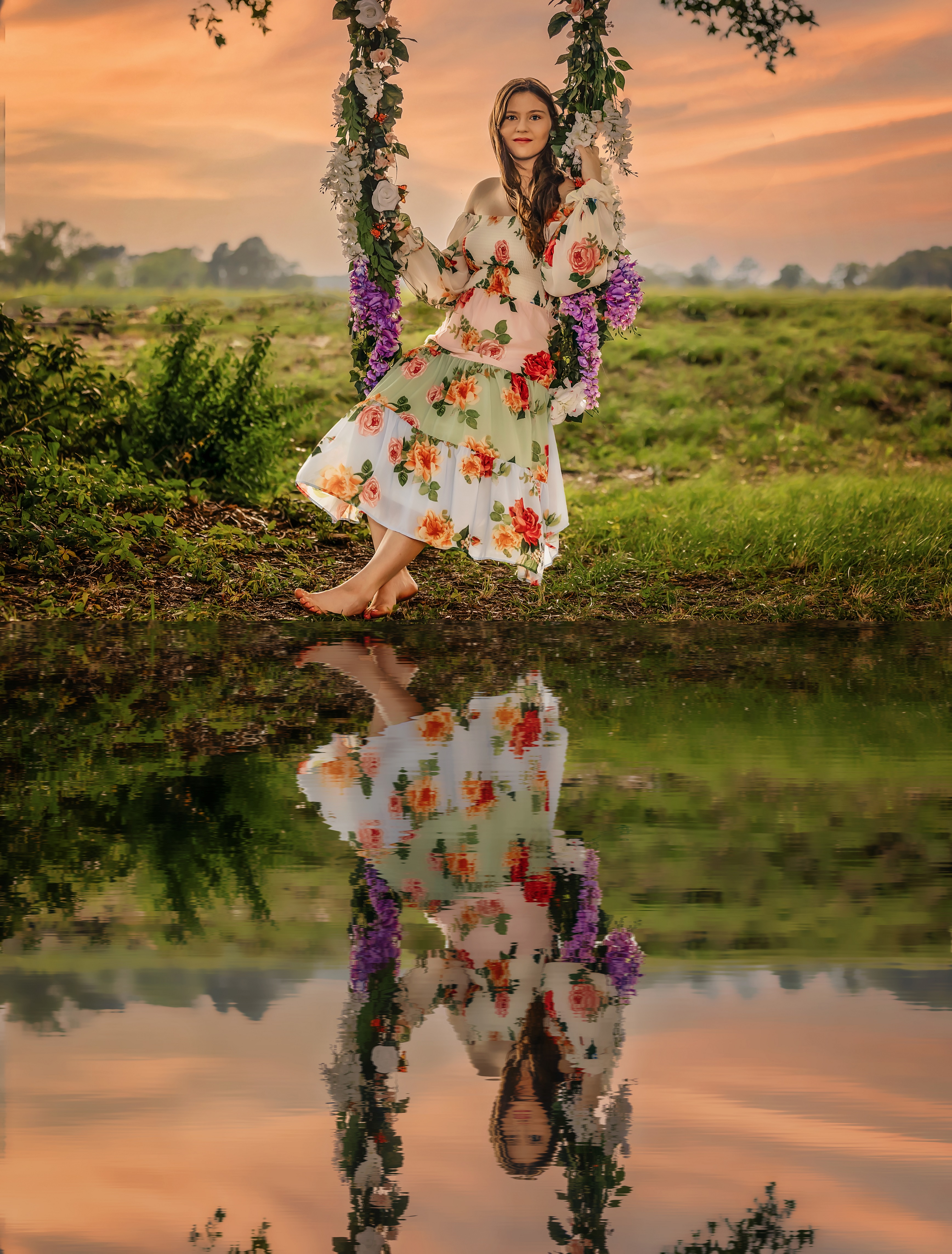 Woman sits on a swing wrapped in vines and flowers